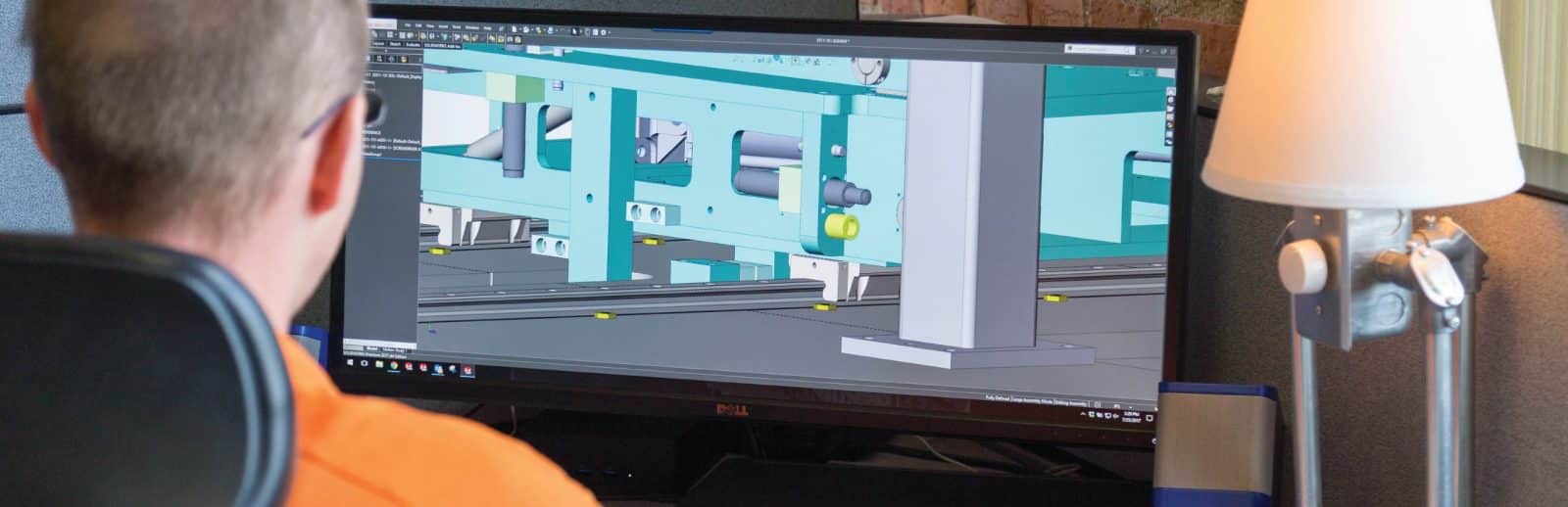 A male engineer looking at CAD on his computer