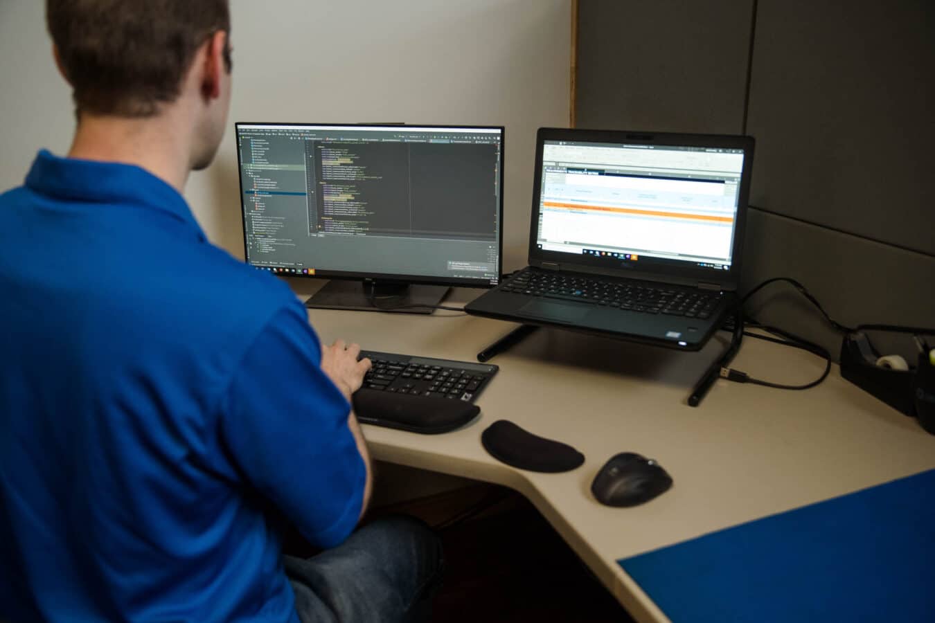 Software Developer writing code on computer