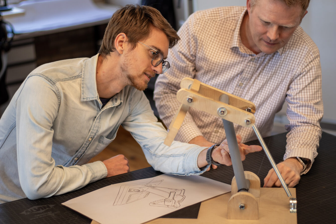 Two conceptual design engineers working on a prototype
